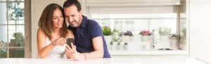 couple shopping for contractor on mobile
